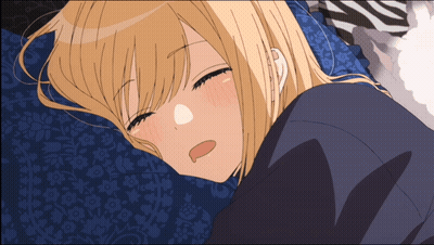 Blonde Girl Laying On Blue Pillow With Eyes Closed GIF