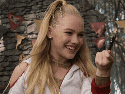 Blonde Girl Smiling Holding Pen GIF