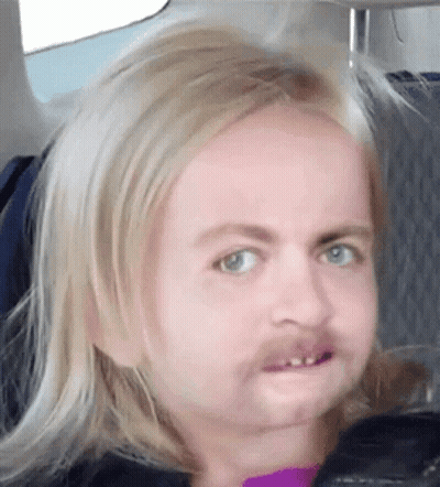 Blonde Girl With Fake Mustache Making Funny Face GIF