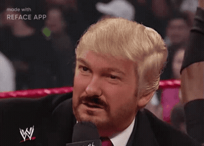 Blonde Haired Bearded Man In Suit Speaking Into Microphone GIF