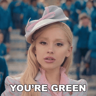 Blonde In Pink Dress And White Hat Saying You're Green GIF