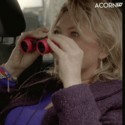 Blonde Lady Spy Using Binoculars GIF