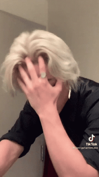 Blonde Man Covering Face With Ring On Hand GIF