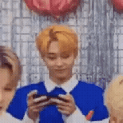Blonde Man Holding Cell Phone GIF