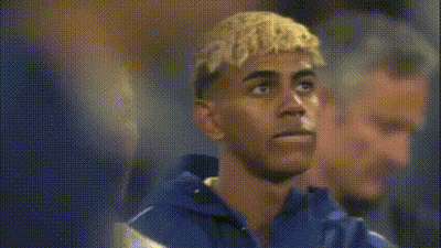 Blonde Man Next To Man In Blue Shirt GIF