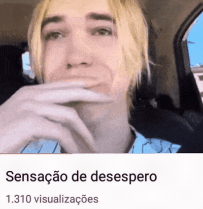 Blonde Man Sitting In Car With Hand Over Mouth GIF