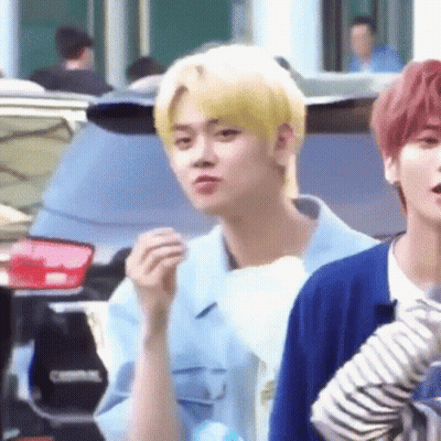 Blonde Man Standing Next To Blue Shirt Man GIF