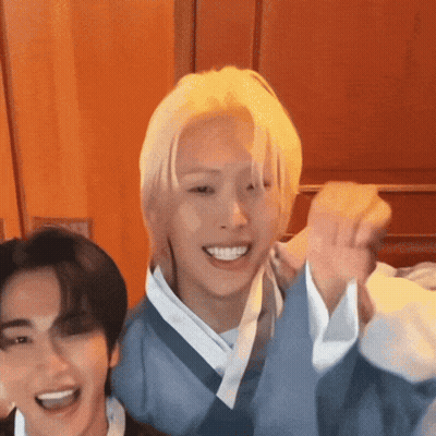 Blonde Man Standing Next To Man In Blue Kimono GIF