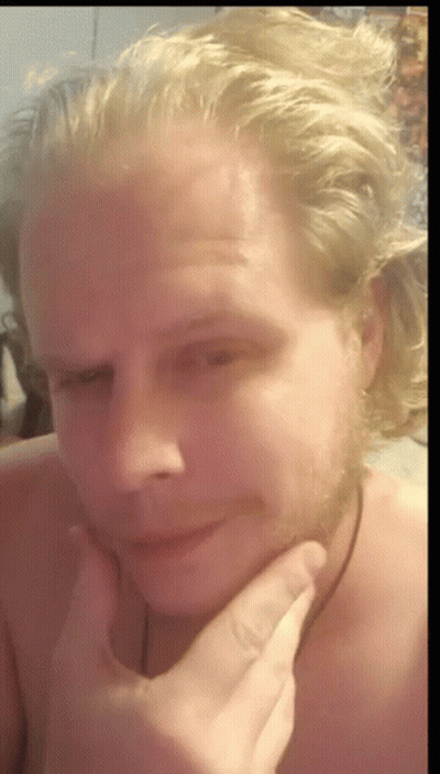 Blonde Man With Beard Holding Hand To Face GIF