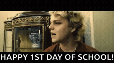 Blonde Man With Happy 1St Day Of School Sign GIF