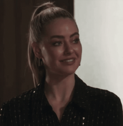 Blonde Ponytail Woman Smiling In Black Shirt GIF