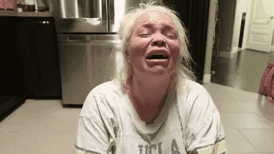 Blonde Woman Crying In Kitchen UCLA Shirt GIF
