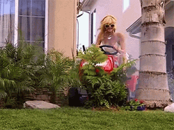 Blonde Woman Gardening Happily