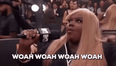 Blonde Woman Holding Microphone GIF