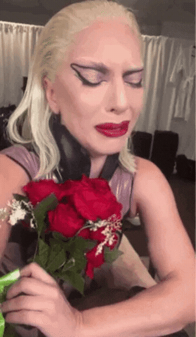 Blonde Woman Holding Red Roses GIF
