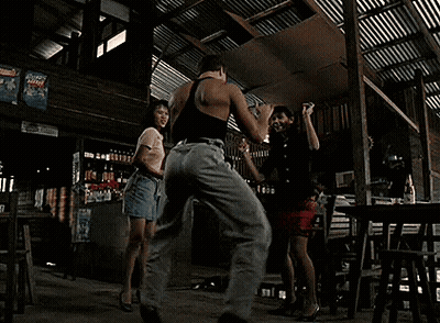 Blonde Woman In Black Bra And Necklace Looking Away GIF
