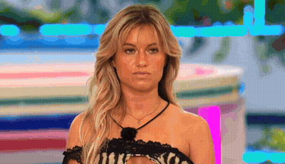 Blonde Woman In Black Lace Top And Necklace GIF