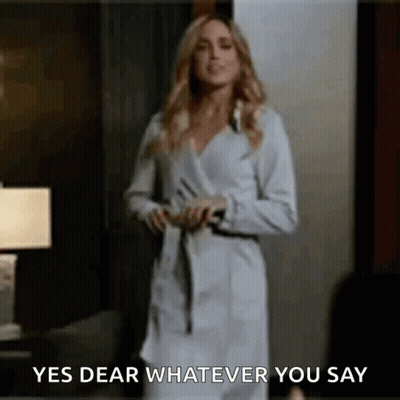 Blonde Woman In Black Mask And Suit GIF
