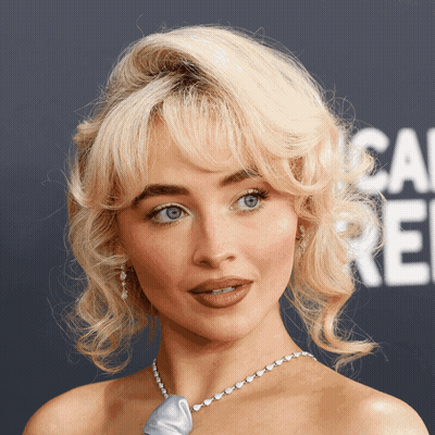 Blonde Woman In Blue Necklace GIF