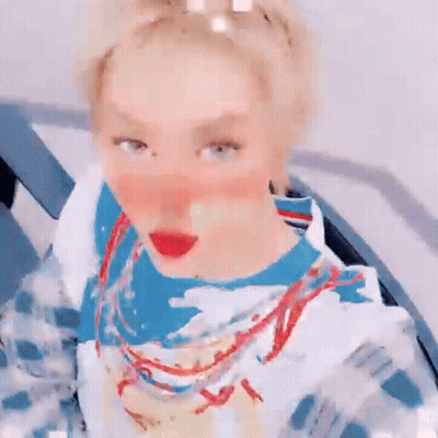Blonde Woman In Blue White Shirt With Necklace GIF