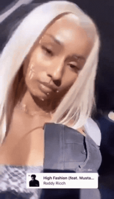 Blonde Woman In Denim Jacket And Necklace GIF