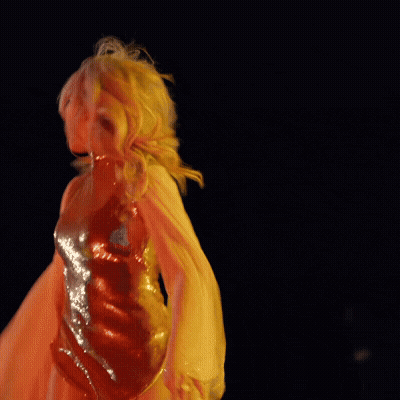 Blonde Woman In Gold Dress With Wings GIF