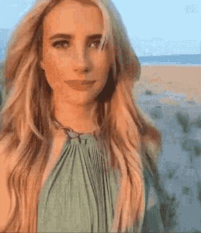 Blonde Woman In Green Dress On Beach GIF