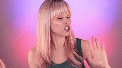 Blonde Woman In Green Tank Top Making Funny Face GIF