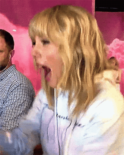 Blonde Woman In Headphones Making Funny Face GIF