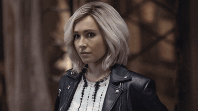 Blonde Woman In Leather Jacket And Necklace GIF