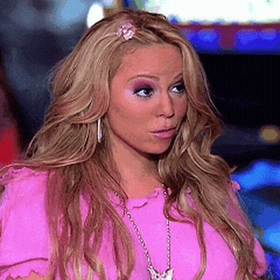Blonde Woman In Pink Shirt And Necklace GIF