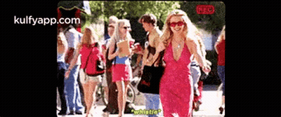 Blonde Woman In Polka Dot Shirt And Black Jacket GIF