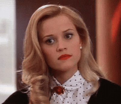 Blonde Woman In Polka Dot Shirt And Black Jacket GIF