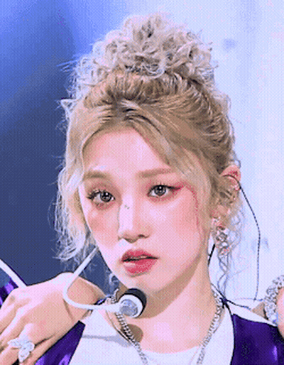 Blonde Woman In Purple Jacket And White Shirt GIF
