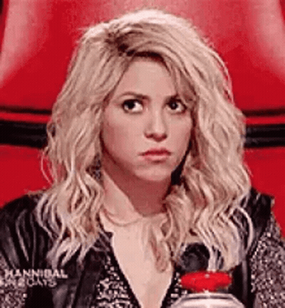 Blonde Woman In Red Chair Holding Water GIF