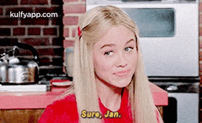 Blonde Woman In Red Shirt Talking To Man GIF