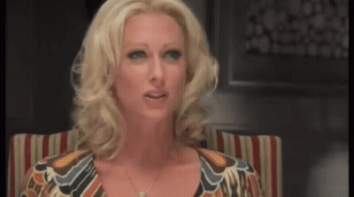 Blonde Woman In Striped Shirt And Necklace GIF