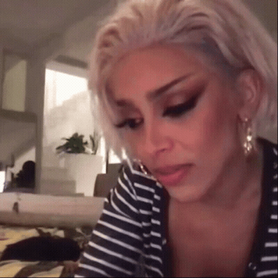 Blonde Woman In Striped Shirt Making Funny Face GIF