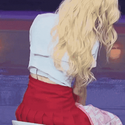 Blonde Woman In White Shirt And Red Skirt GIF