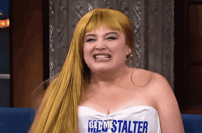 Blonde Woman In White Top Saying Get Me Stalter GIF