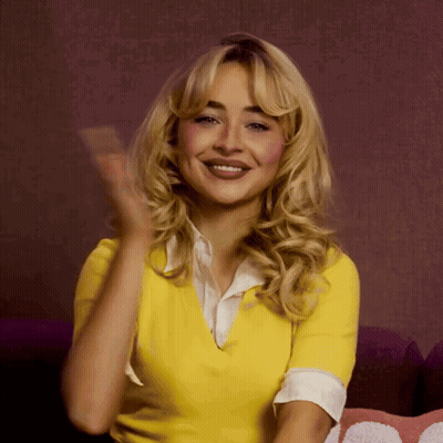 Blonde Woman In Yellow Shirt Smiling And Clapping GIF