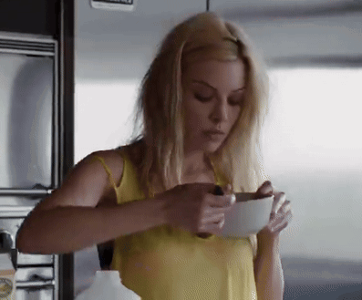 Blonde Woman In Yellow Tank Top Holding White Bowl GIF