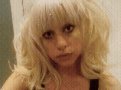 Blonde Woman Looking At Camera Seriously GIF