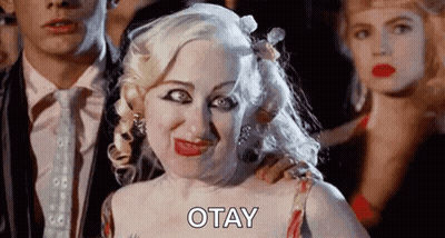 Blonde Woman Making Funny Face Next To Man And Woman GIF