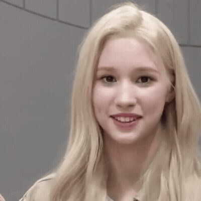 Blonde Woman Making Funny Face Next To Woman GIF