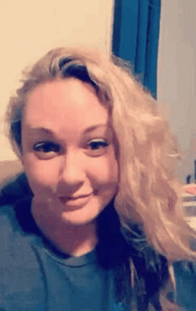 Blonde Woman Making Funny Face On Couch GIF