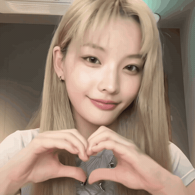Blonde Woman Making Heart With Hands GIF