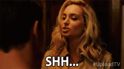 Blonde Woman Making Shh Face GIF