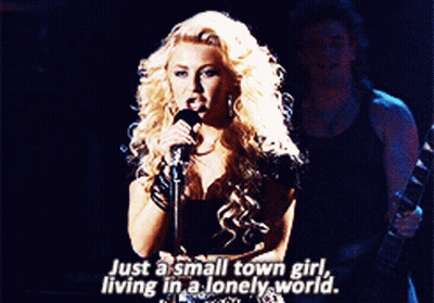 Blonde Woman Singing Just A Small Town Girl GIF
