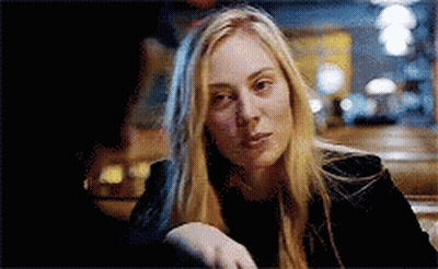 Blonde Woman Sitting At Table Hand On Shoulder GIF